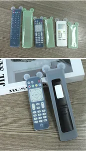Detailed view of translucent silicone remote control covers with cute ear designs.