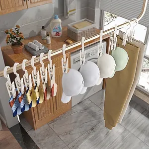 Perchas multifuncionales de plástico blanco con clips para calcetines, gorros y pantalones.