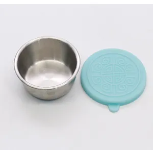 Small stainless steel condiment cup with a decorative blue silicone sealing lid for fresh storage.