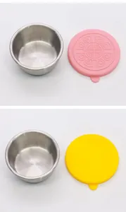 Detailed view of stainless steel condiment cups with pink and yellow silicone lids