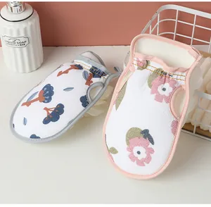 Detail of floral patterned double-sided bath mitt with soft exfoliating texture