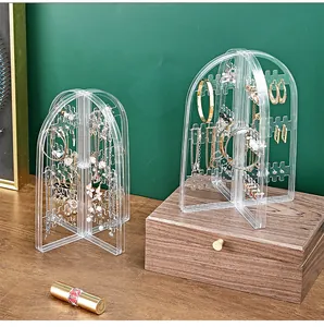 Detailed view of a transparent acrylic arched jewelry stand for earrings and necklaces