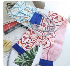 Close-up of long exfoliating back scrubbing towels with printed patterns and ropes