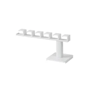 Minimalist white L-shaped wall-mounted headband and hair accessory storage organizer