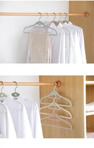 Detailed view of cascading plastic clothes hangers for space-saving closet storage