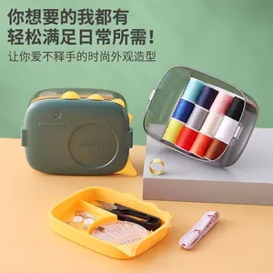 Complete portable sewing kit set featuring dinosaur-themed storage box and colorful threads