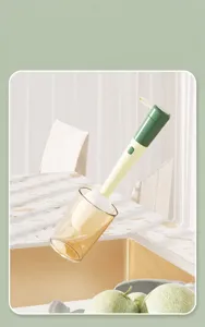 Long-handled 3-in-1 cup brush cleaning a glass cup in a modern kitchen setting