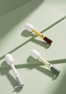 Detail view of microphone-shaped 3-in-1 cup brush sets in three stylish color options.
