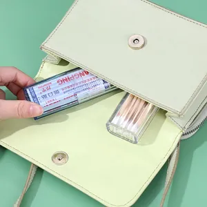 Transparent portable storage boxes for small items like bandages and cotton swabs in a bag
