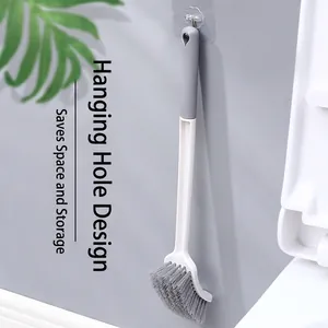 Wall-mounted toilet brush with curved head and space-saving hanging design for bathroom
