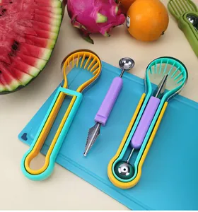 Detail of 3-in-1 multifunctional fruit scooper and carving knife set for fruit platter preparation.