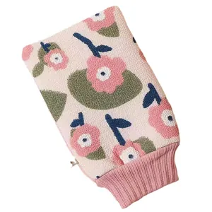 Floral exfoliating bath glove featuring a pink flower pattern and ribbed cuff
