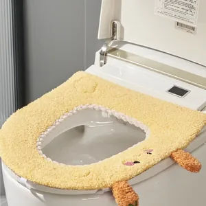 Thick yellow plush toilet seat cover with cute carrot cartoon design for winter warmth