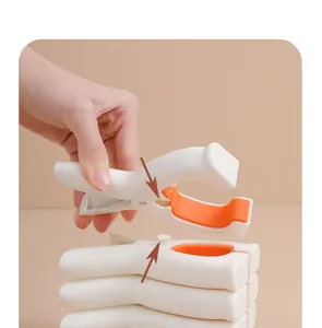 Detailed view of a large windproof plastic quilt clip with a non-slip silicone grip