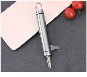Durable stainless steel macadamia nut opener tool displayed on a clean kitchen surface