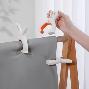 Large windproof plastic quilt clips for bedsheets shown in a functional home drying scene