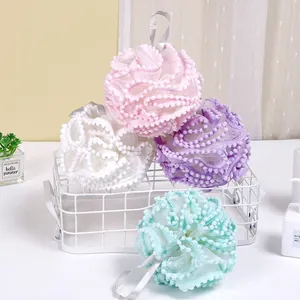 Set of four soft pastel mesh bath sponges with hanging loop and decorative ruffled edges