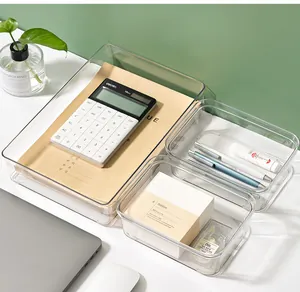 Professional set of three clear plastic organizers for desktop stationery storage.
