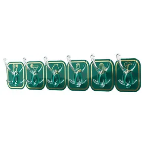 Minimalist green punch-free row of 6 adhesive wall hooks with decorative golden patterns