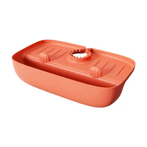 Detailed view of orange silicone faucet drip catcher mat with built-in drainage grooves