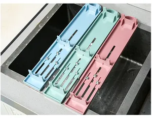 Adjustable kitchen sink whetstone holders in blue green and pink colors displayed together