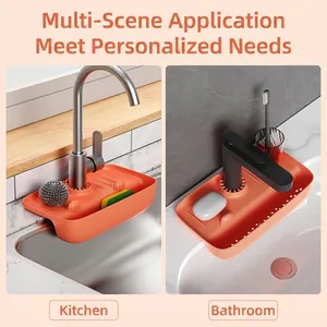 Detailed view of orange silicone faucet splash guard in kitchen and bathroom sinks