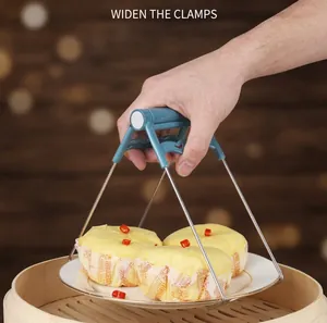 Anti-scald stainless steel kitchen plate lifter tool shown lifting cakes in a steamer