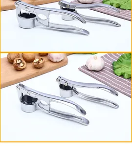 Detailed close-up of a manual garlic press and walnut cracker with stainless steel finish
