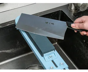Detailed view of an adjustable whetstone holder securely mounted over a kitchen sink