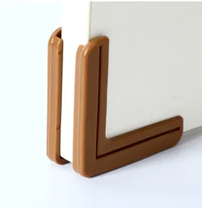 Close-up detail of a brown L-shaped safety corner protector for window and door edges