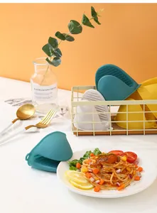 Heat-resistant silicone mini oven mitts for hot plates and pots in kitchen setting