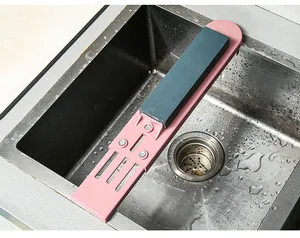 Detail view of pink retractable whetstone holder mounted over a kitchen sink