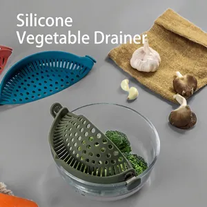 Silicone clip-on pot strainer for vegetables and pasta, versatile kitchen drainage tool.