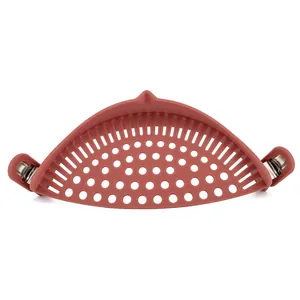 Clip-on silicone pot strainer for draining pasta and vegetables in terracotta color