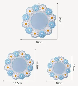 Drei verschiedene Größen von hitzebeständigen Silikonmatten mit Gänseblümchen-Design