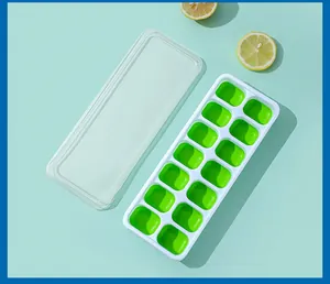 Detailed top view of a 14-cavity silicone ice cube tray with transparent lid and lemons