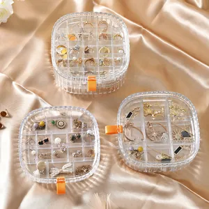 Set of clear acrylic jewelry organizer boxes with multiple grids for rings and earrings