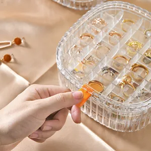 Elegant transparent jewelry storage box with multiple compartments for rings and earrings