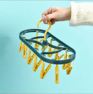 Durable plastic laundry drying rack with 12 yellow clips for socks and underwear