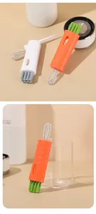 Detailed view of the 3-in-1 carrot-shaped cleaning brush for bottle caps and gaps.