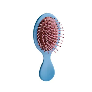 Simpatica mini spazzola per capelli portatile con cuscinetto d'aria e setole rosa