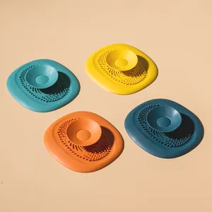 Set of four colorful silicone sink hair catchers with suction handle for drain protection