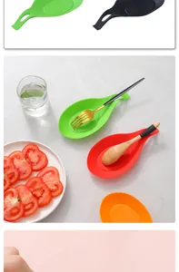 Heat resistant colorful silicone spoon rests for kitchen utensils shown in a lifestyle setting