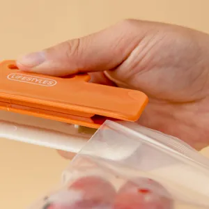 Portable orange plastic food bag sealer clip for fresh kitchen snack storage sealing