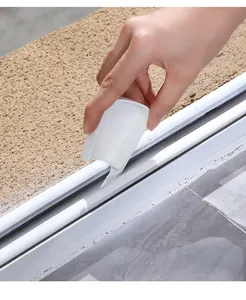 Macro detail of a high-quality white plastic crevice cleaning brush for windows