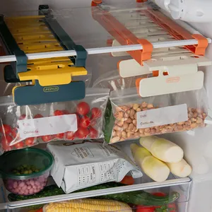 Adjustable refrigerator hanging storage rack with sealable food bags and clips