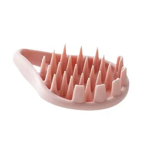 Brosse de massage du cuir chevelu en silicone pour l'élimination des pellicules rose