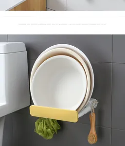 Detail view of a foldable wall hanging washbasin rack holding multiple basins in a bathroom