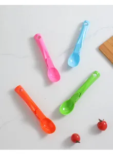 Detailed view of thickened plastic ice cream scoops in four bright colors with trigger