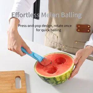 Ergonomic blue plastic fruit scooper used to create perfect watermelon balls easily